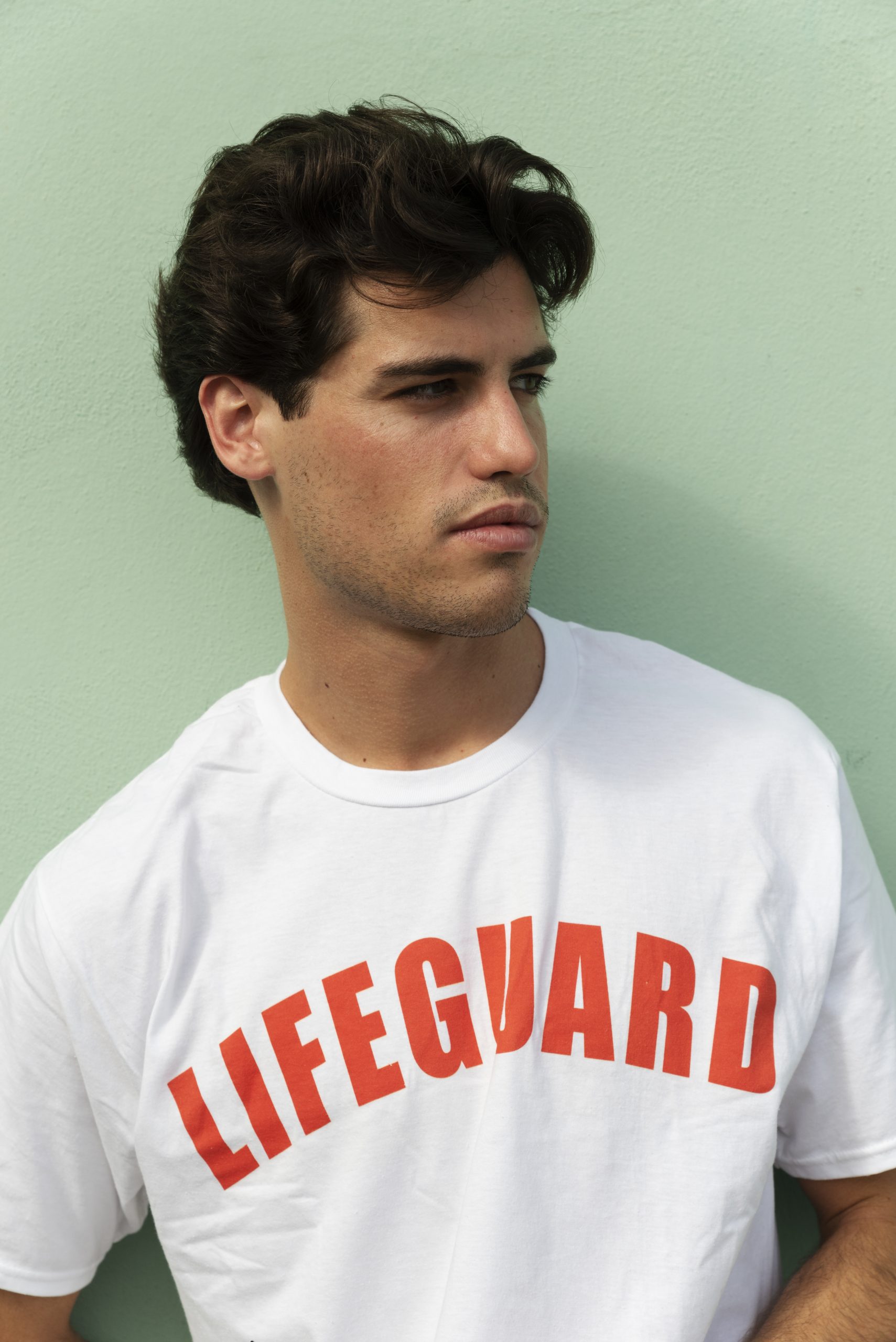 medium-shot-lifeguard-with-green-background